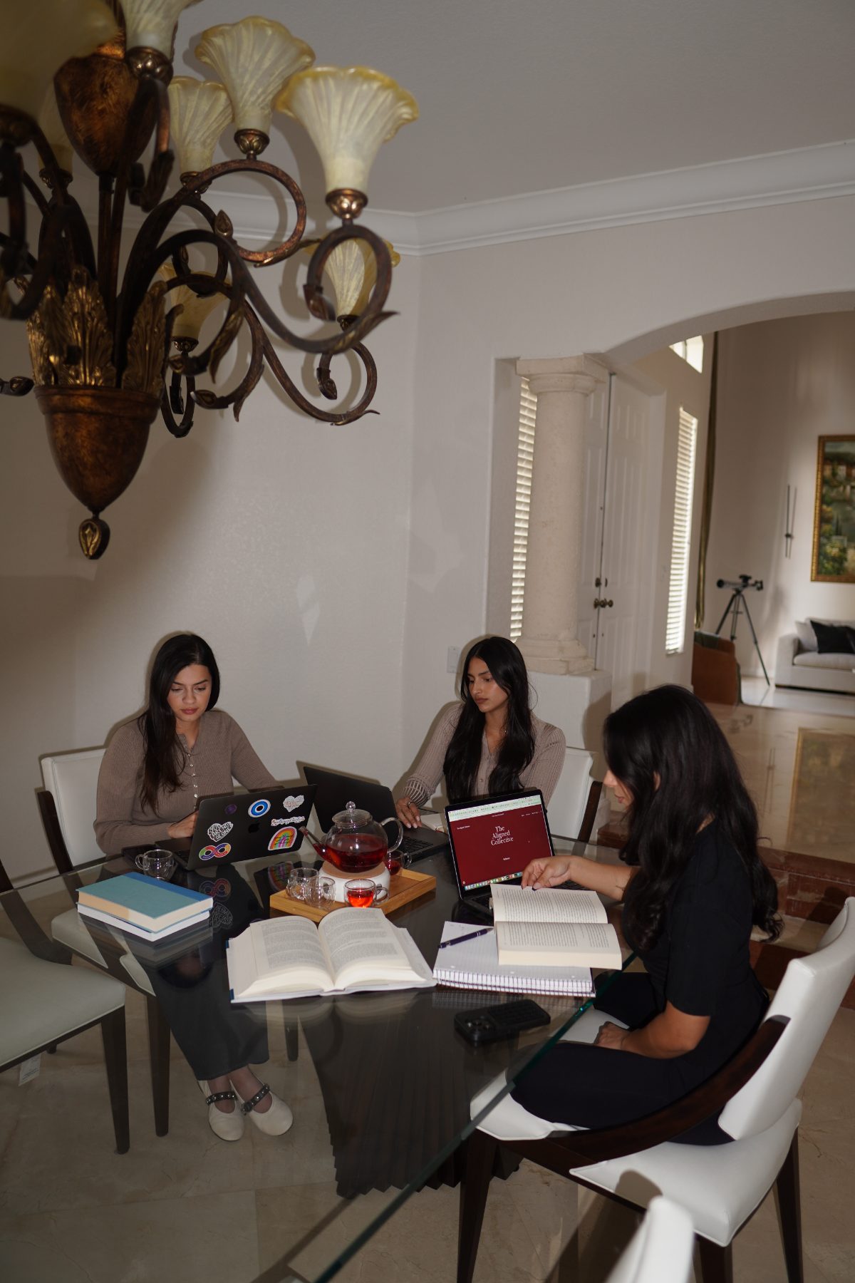 Amanda, Amber and Natalia working together around a table